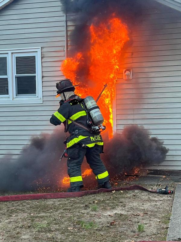 Residential Structure Fire: members from E-15 ventilating fire area  prior to hose line advance.   2023