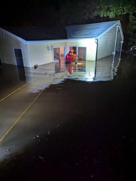 Water Rescue: Members from Co.1 making entry to flooded house.  2024