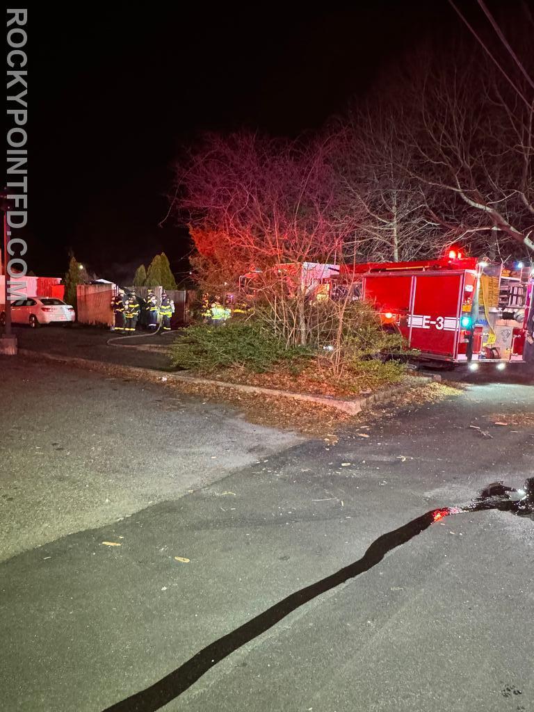 Dumpster Fire: E-3 stretches hose line to extinguish dumpster Fire.  2024