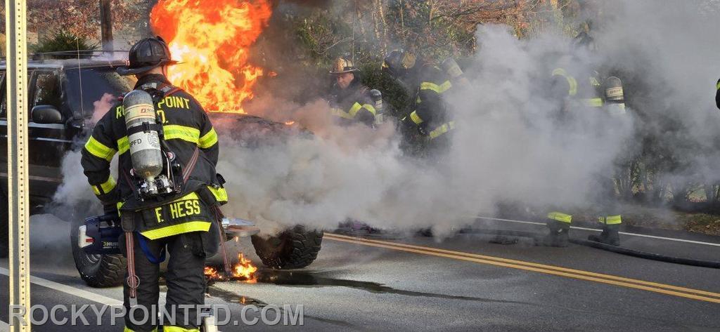 Vehicle Fire: Members from E-7 preparing to extinguish car fire 
2024